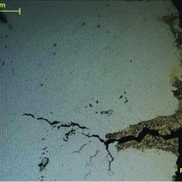 Section through surface of sample showing corrosion and intergranular cracking, unetched